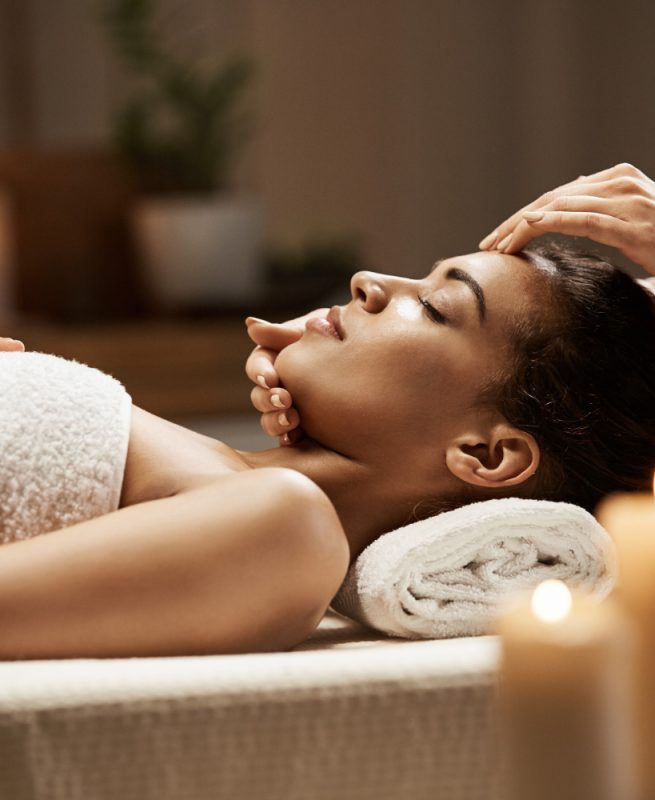 attractive-african-woman-enjoying-face-massage-spa-salon attractive-african-woman-enjoying-face-massage-spa-salon